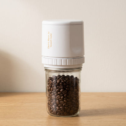 Alva Oro Mason jar vacuum sealer in white on a jar of coffee beans