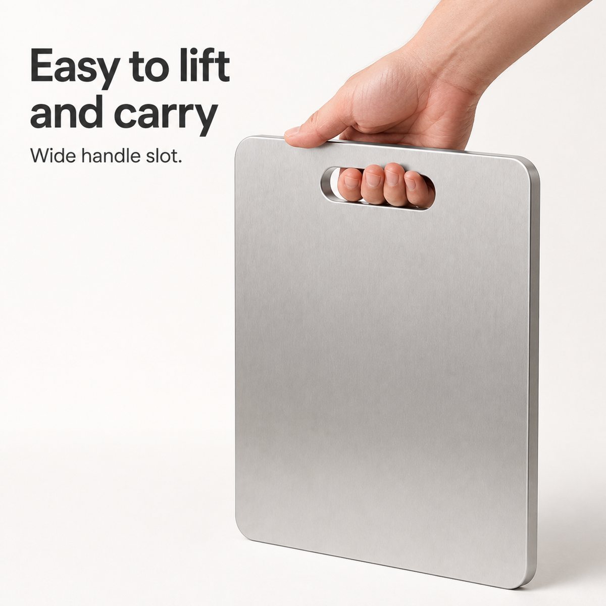 Hand lifting the board by its wide handle slot